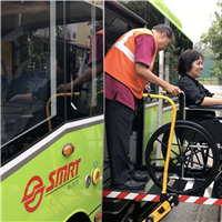 SMRT Bus Captain assists an alighting wheelchair commuter